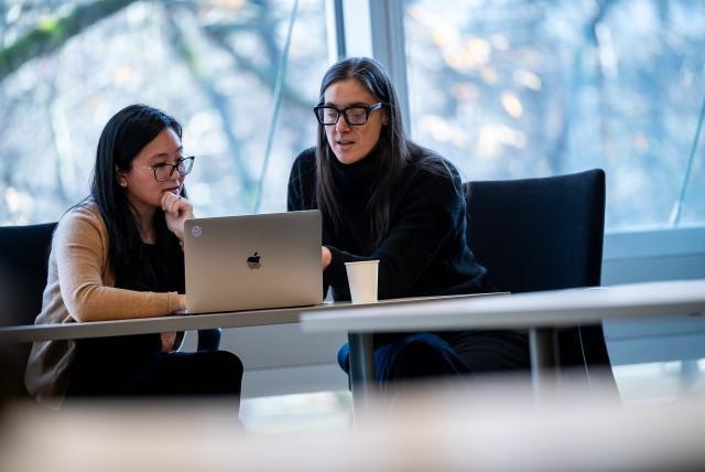 A student is discussing something with the academic advisor.