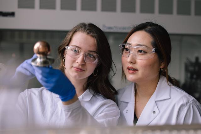 Two students working in a lab.
