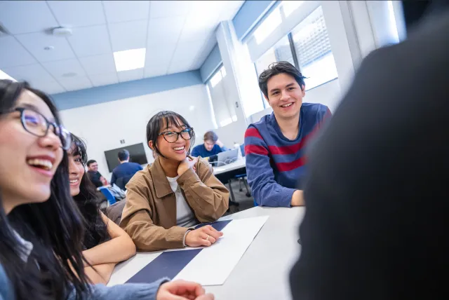 Students laughing in a group setting