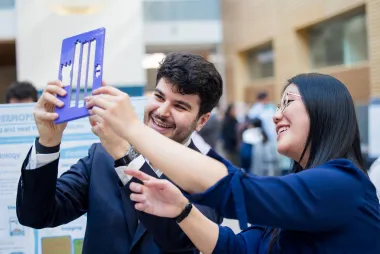 Students holdings their capstone project
