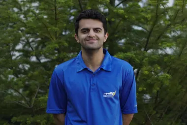 A headshot of Arman Hariri