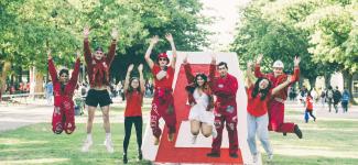 Students jumping on the grass