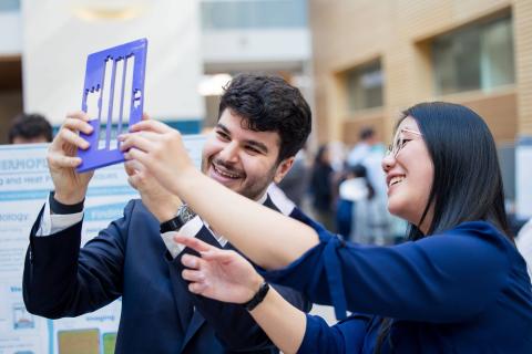 Students holdings their capstone project